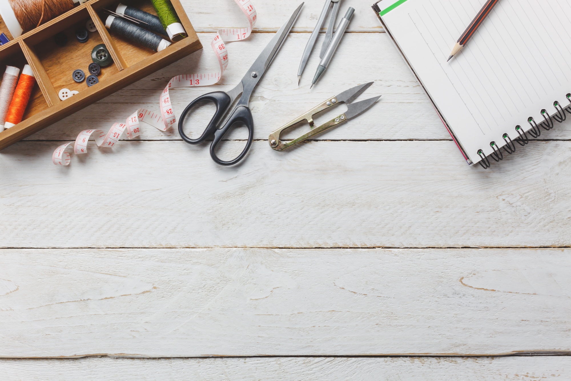 studio table with threads and hoops